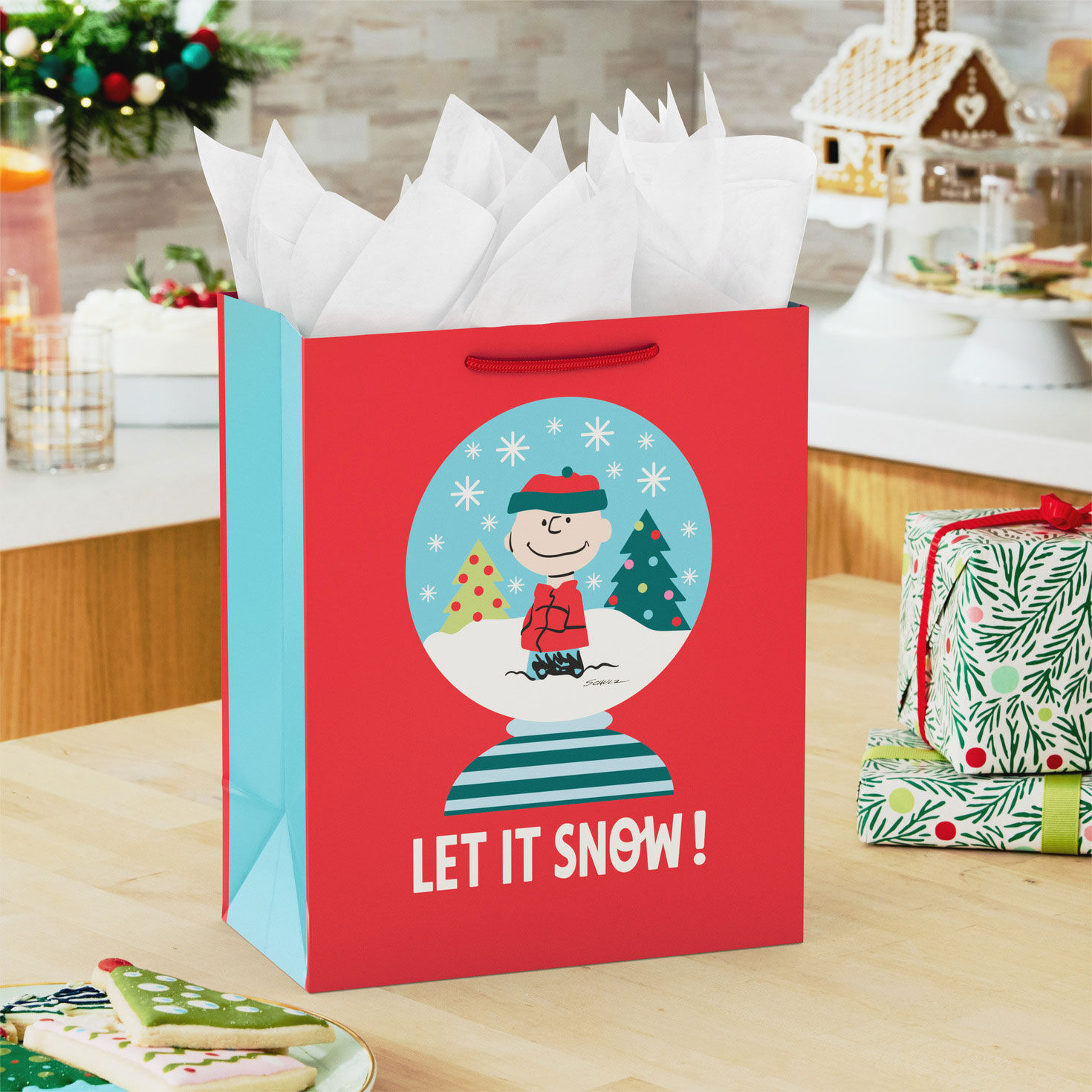 Red Charlie Brown Snow globe Medium Holiday Gift Bag in use image number 2