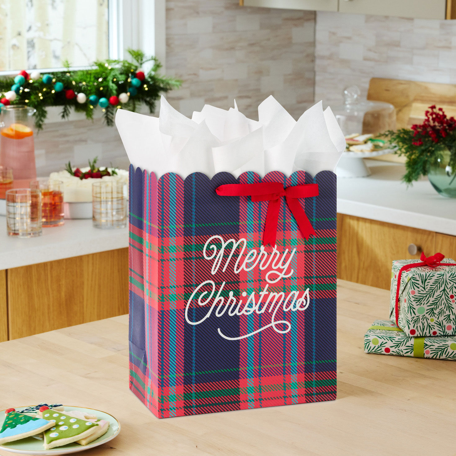 Scalloped Red Plaid Christmas Gift Bag with Ribbon in use image number 2