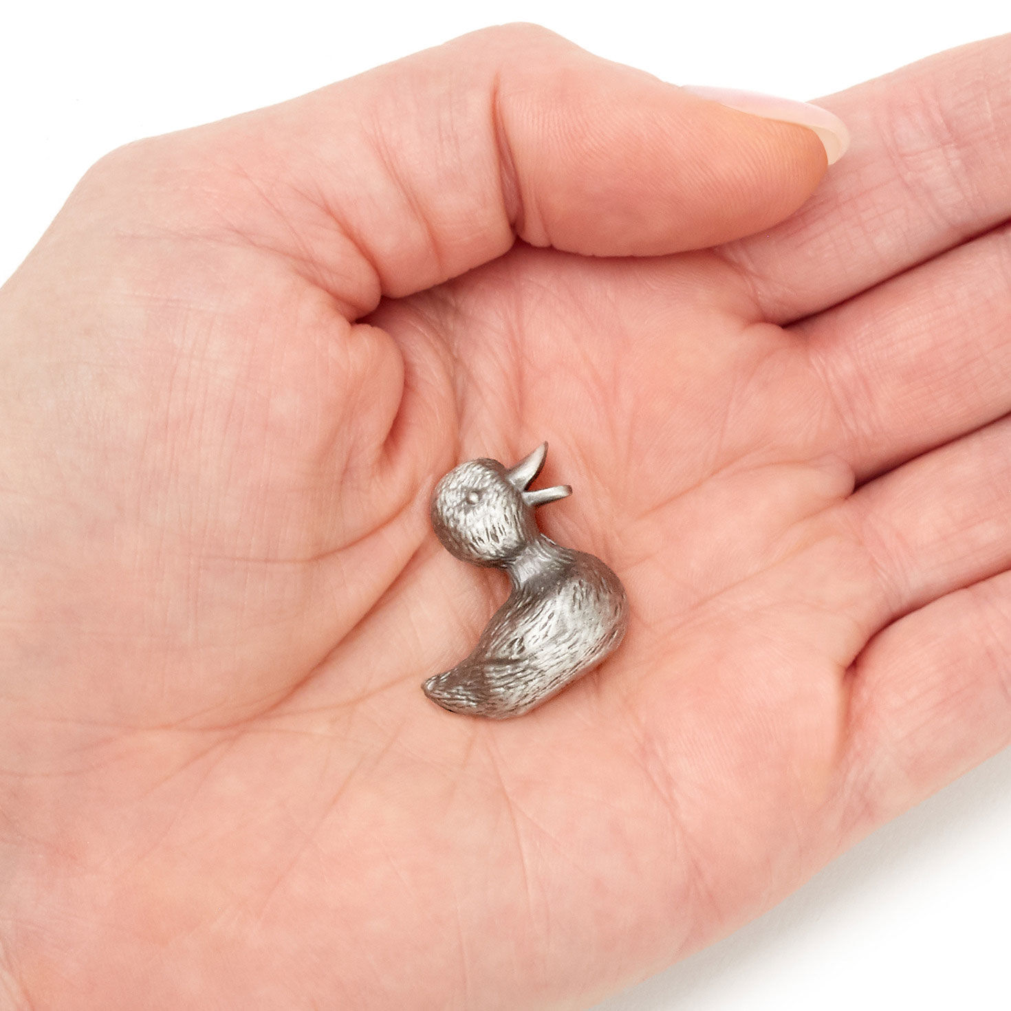 Matte Silver Duckling Metal Token item on hand image number 3