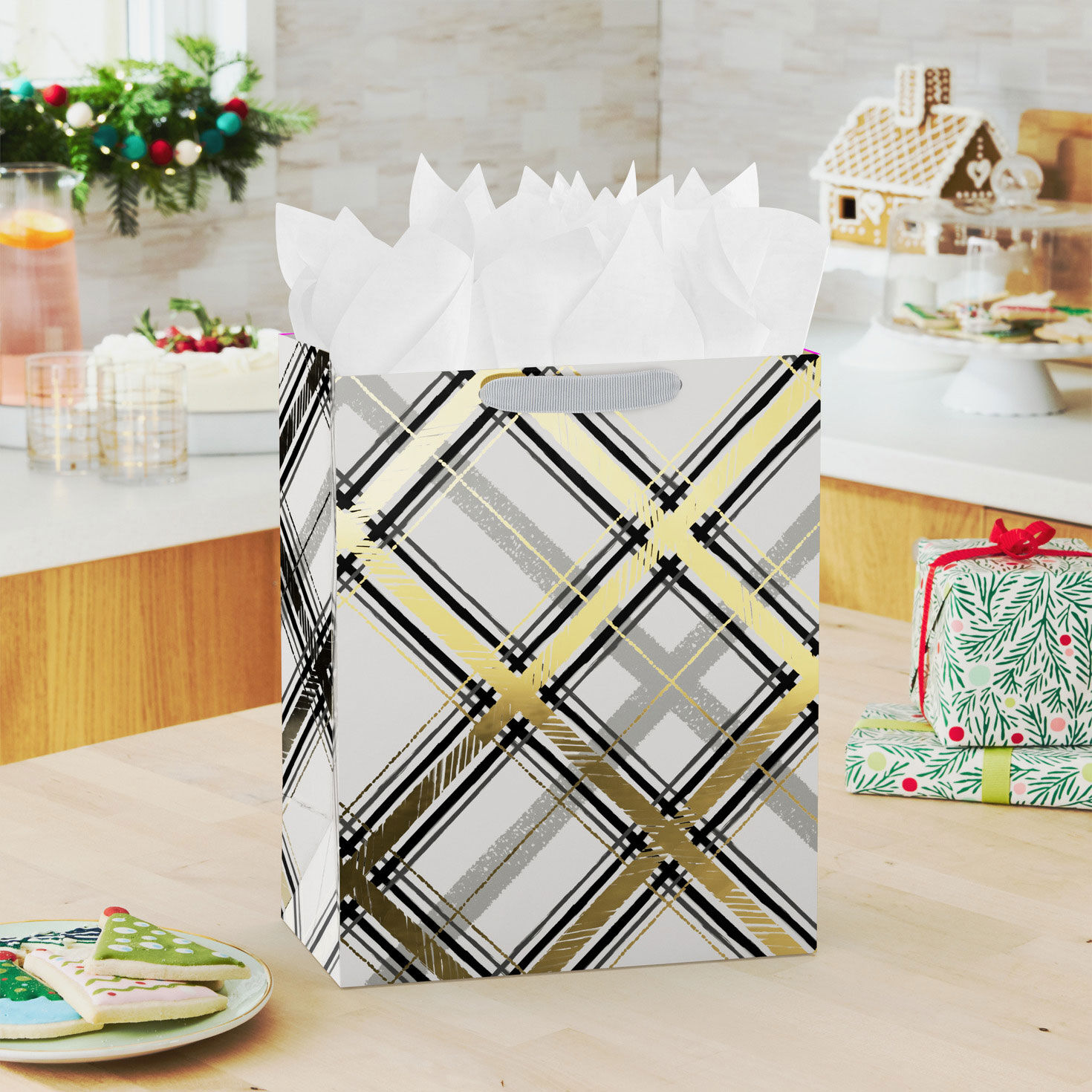 Black and Gold Plaid on White Large Holiday Gift Bag In use image number 2