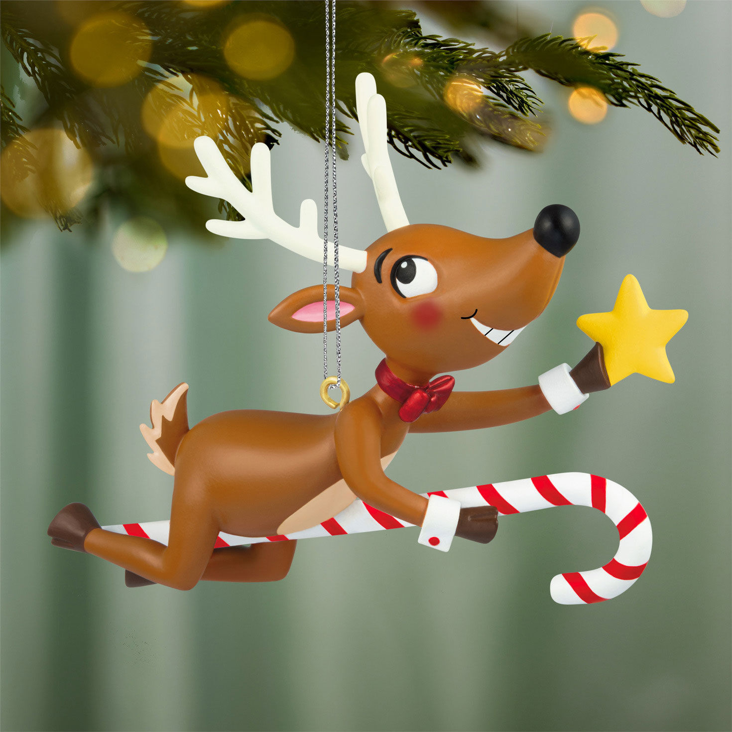 Reindeer Flying on Candy Cane Keepsake Ornament hanging on tree image number 2