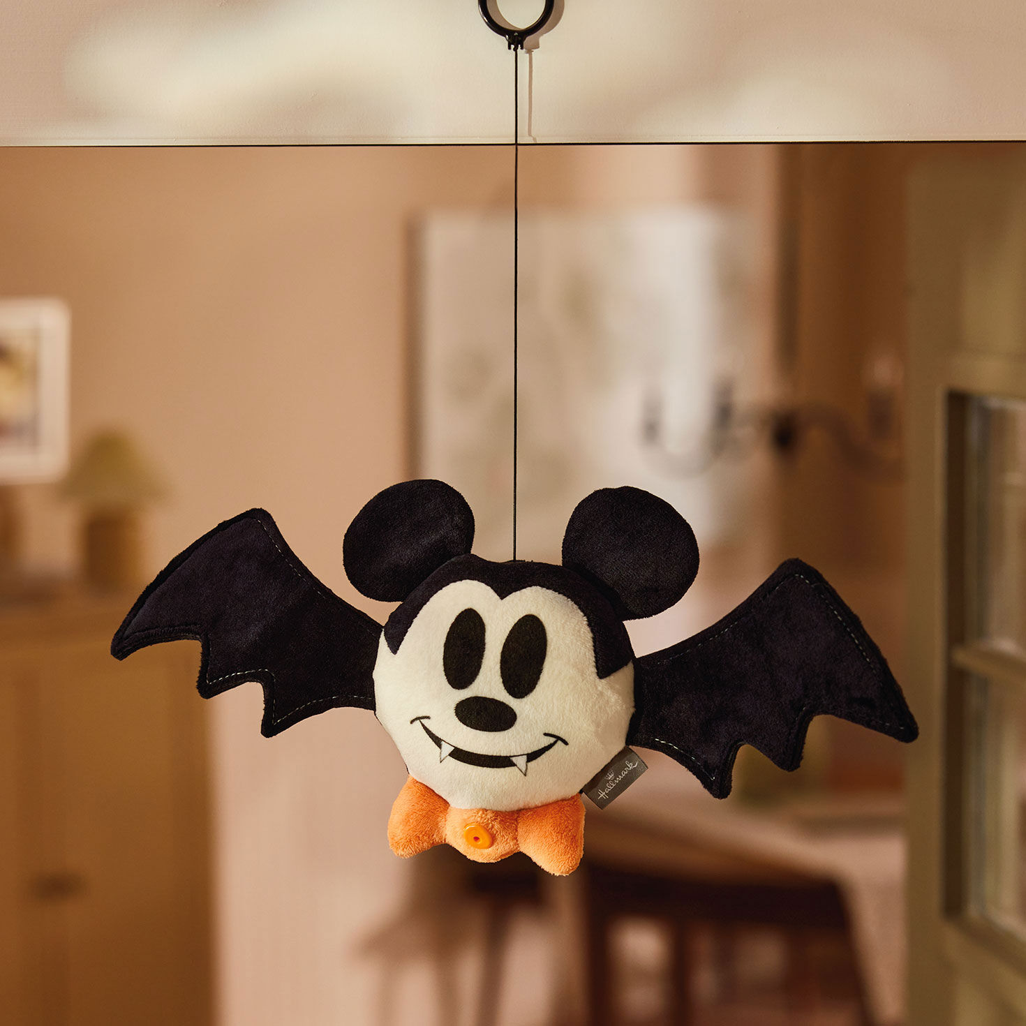 Plush Mickey Mouse Bat on String in use image number 2