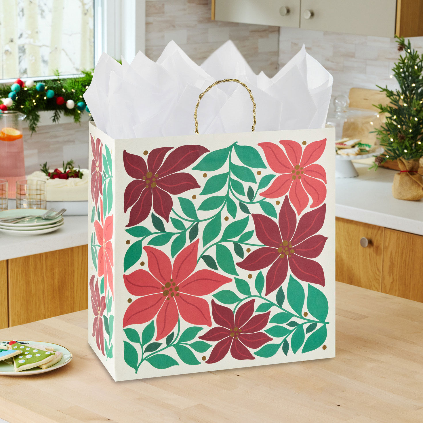 Modern Poinsettia Red Christmas Gift Bag in use image number 2