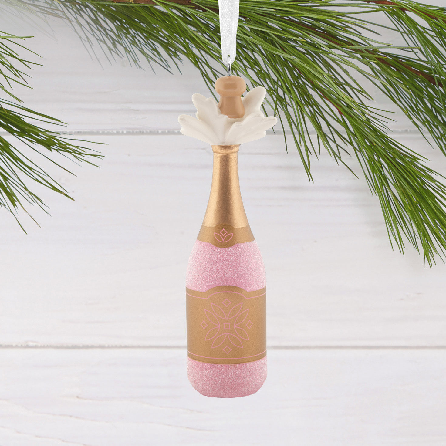 Pink Gold Champagne Bottle Christmas Ornament hanging on tree image number 2