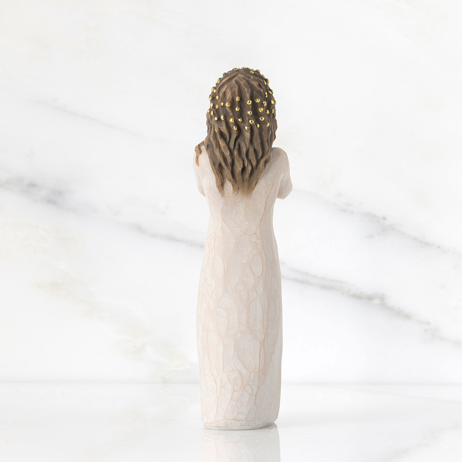 Girl With Hands on Face and Gold Accents Figurine back image number 2