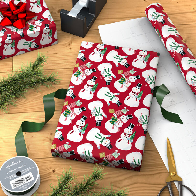 Snowmen on Red Christmas Wrapping Paper Roll in use image number 3