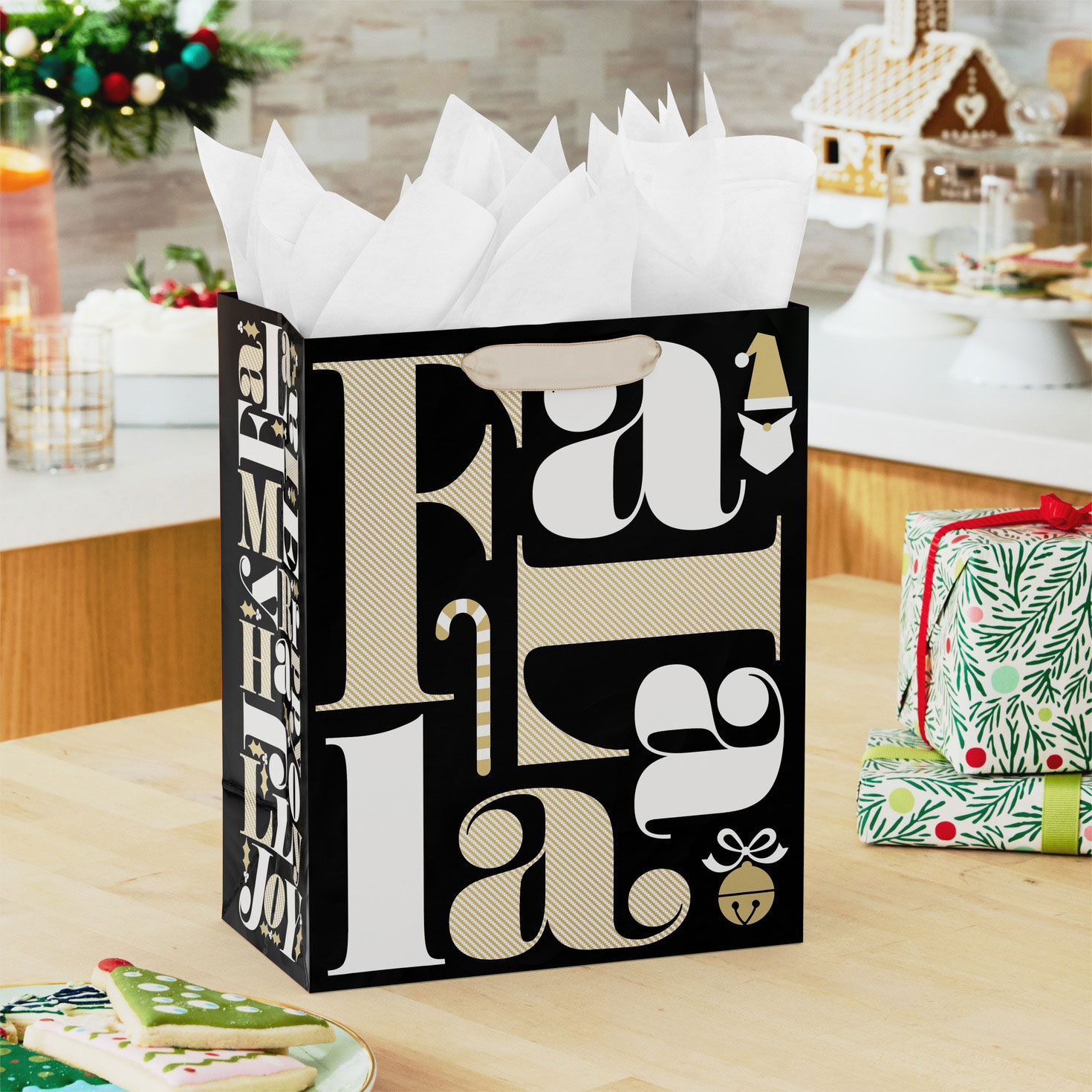 Black and Gold Fa La La Medium Holiday Gift Bag In use image number 2