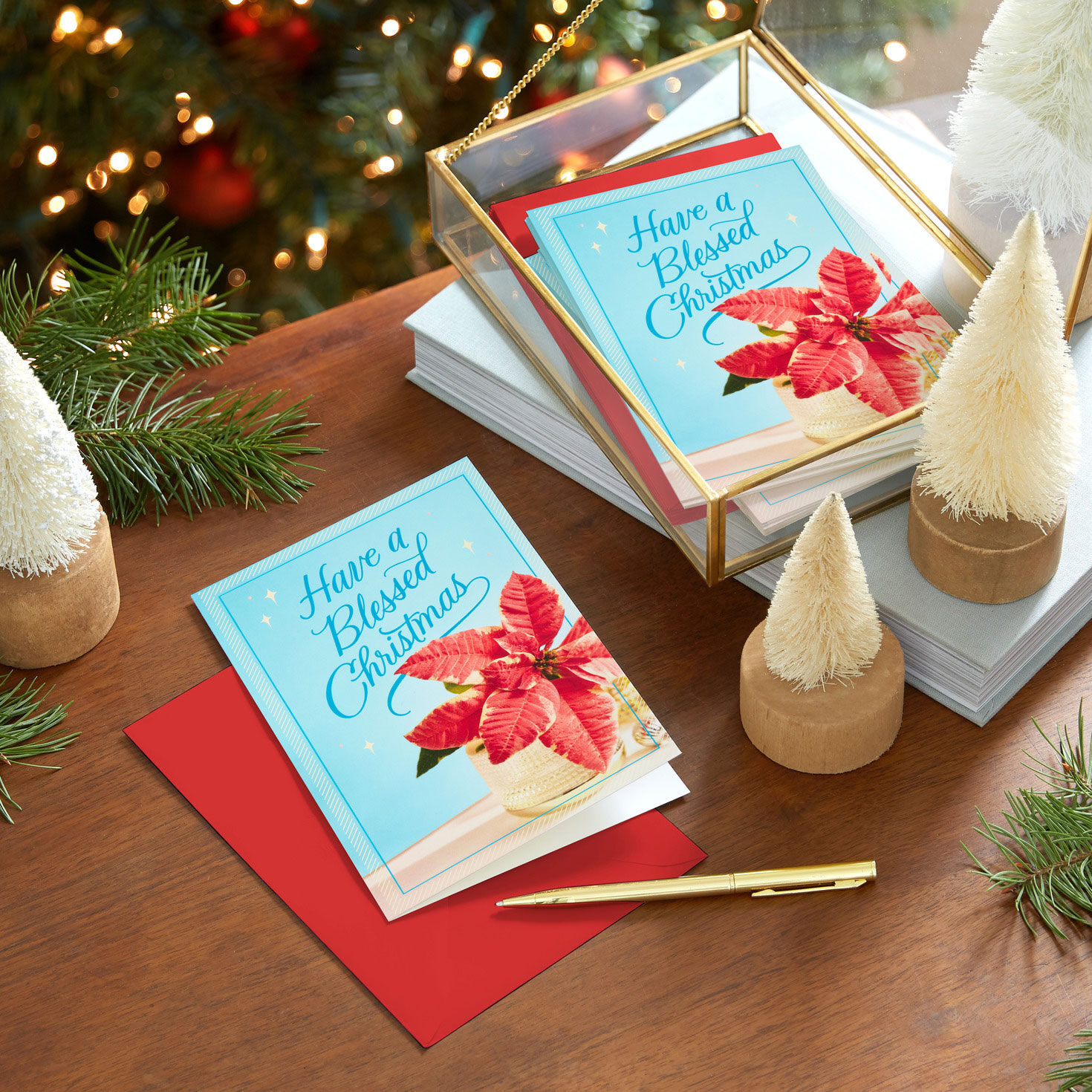 Poinsettia on Blue Boxed Christmas Card Pack in use image number 7