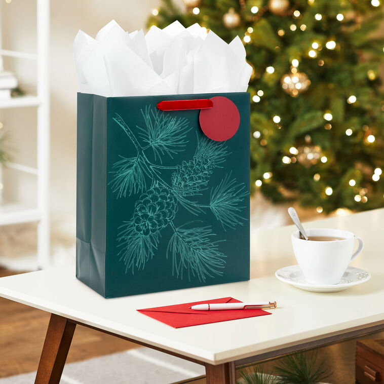Embossed Pine Branch on Green Large Holiday Gift Bag In Use image number 2