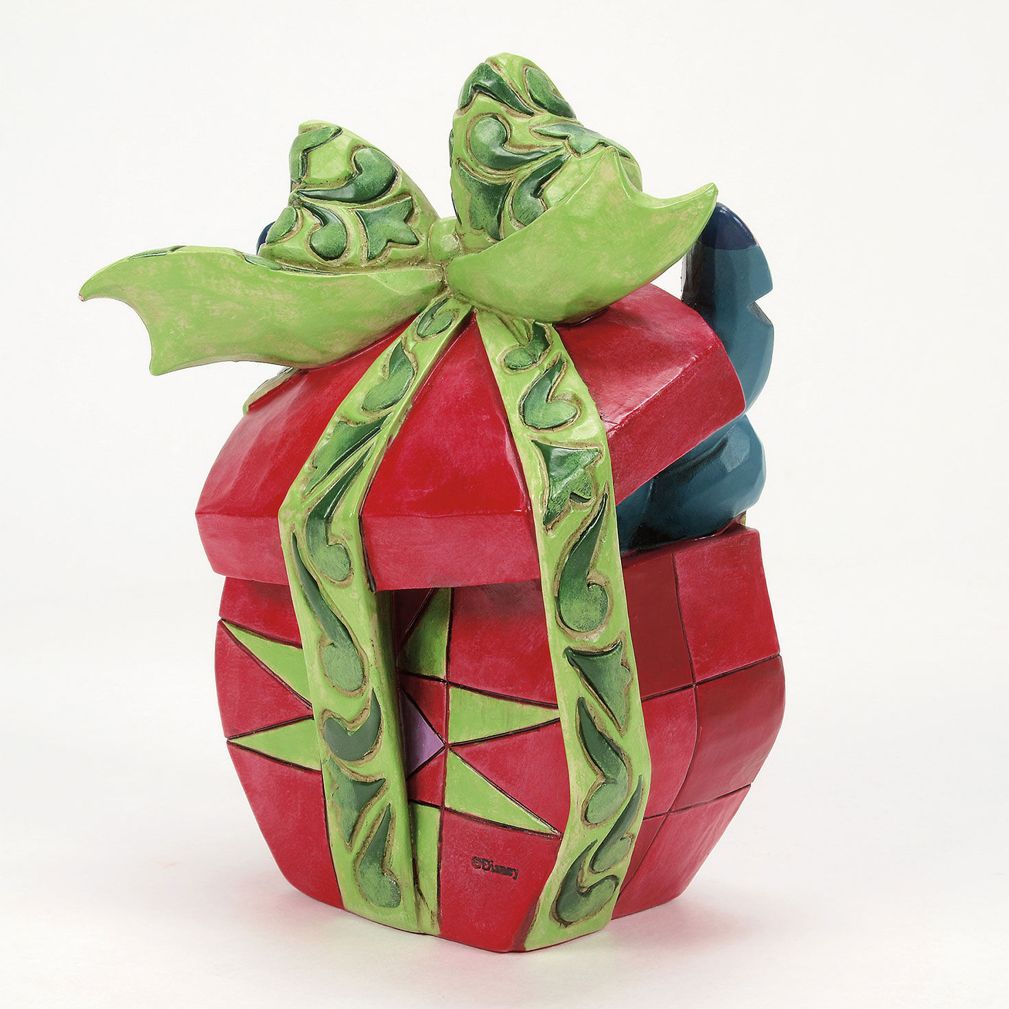 Jim Shore Stitch Popping Out of Gift Figurine angled image number 4