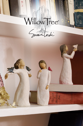 Willow Tree artist Susan Lordis wood carvings of young women holding birds.