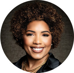Headshot of Dr. Alisha Reed smiling on a dark background