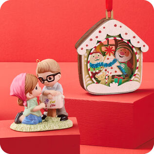 Disney Pixar Precious Moments Ellie and Carl porcelain ornament and 5th Anniversary Gnome for Christmas papercraft ornament on red boxes and background