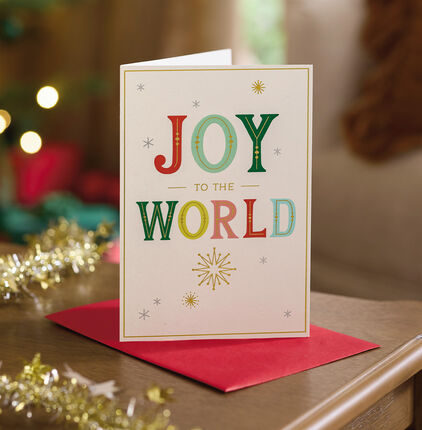 Mostly white card with Joy to the world' on the front.