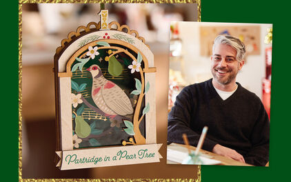 Gregor Benedetti next to his papercraft ornament