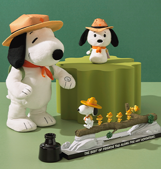 Snoopy plush and a figurine featuring snoopy and wood stock dressed for outdoor adventure