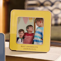 Yellow enamel photo frame with “Best grandkids (seriously)” along the bottom