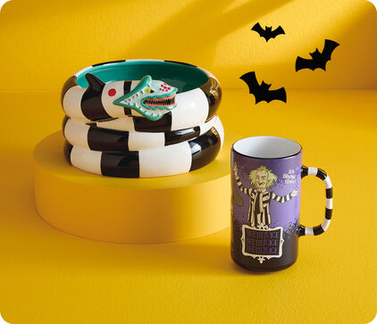 Beetlejuice sand worm mug and Beetlejuice show time mug.