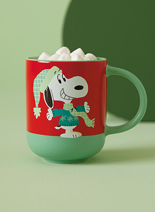 Snoopy in a sweater, scarf and hat on a mug