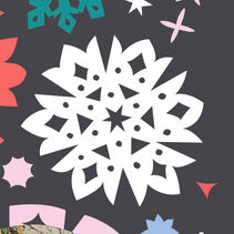 collage of colored paper snowflakes on a dark gray background