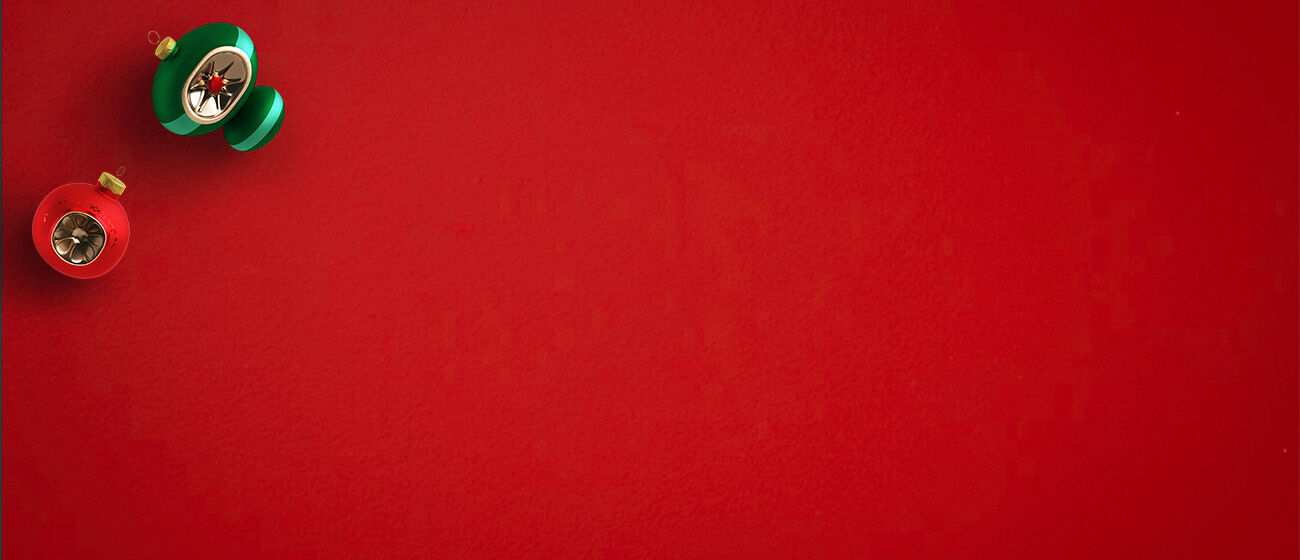 Red background and a red and a green metallic ornament