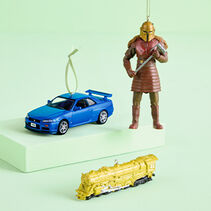 Limited quantity ornaments 1999 Nissan Skyline, The Mandalorian Armorer, and Lionel Trains New York Central 700E Hudson on a green background