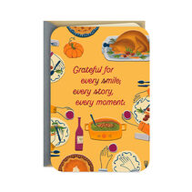 Thanksgiving greeting card featuring illustrated table with turkey, vegetables, pies, wine and hands reaching in. Foil and embossed accents. 