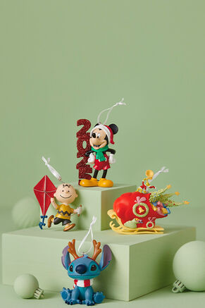 4 ornaments: Mickey Mouse, Charlie Brown, Stitch and the Grinch