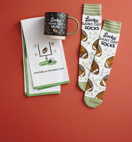 Mug, socks, and tea towel with football designs