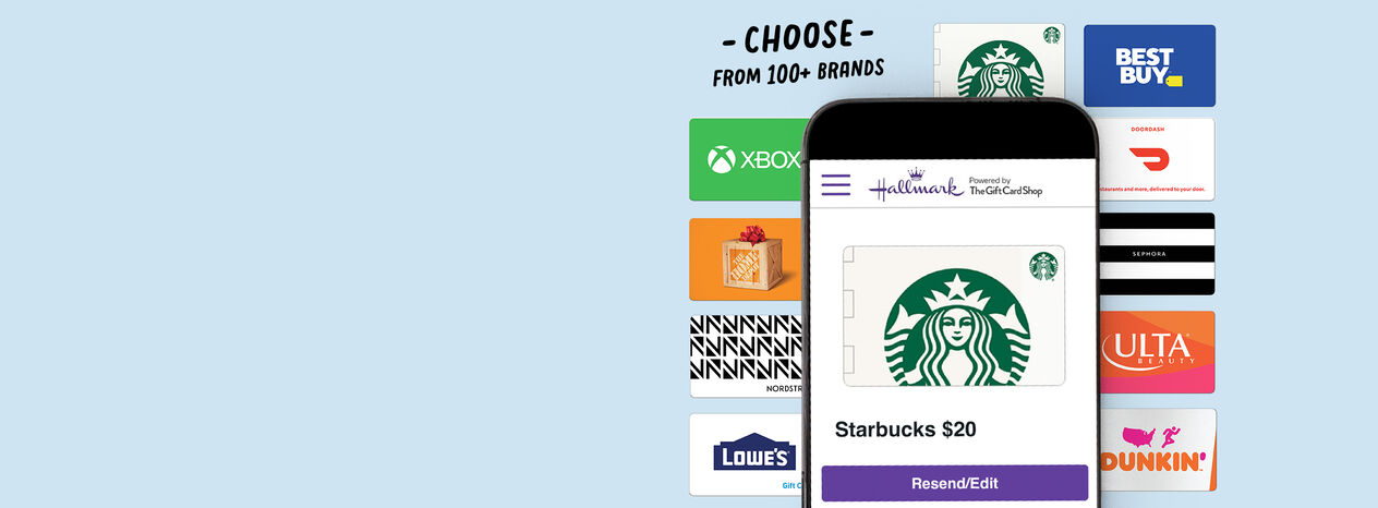 Phone displaying a digital gift card over a spread of gift card brands.