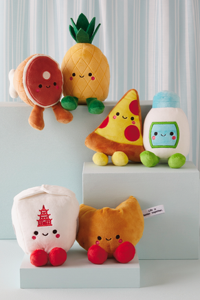 Better Together plush on a shelf including ham and pineapple,' 'pepperoni pizza and ranch', and 'Chinese takeout and fortune cookie'