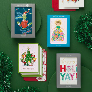 Boxed card assortment on a green background