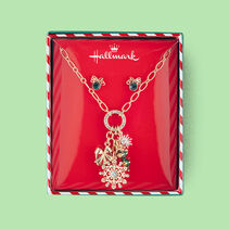 Christmas-themed charms on a necklace.