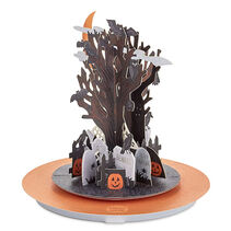 Pop-up Halloween card of a graveyard with a bare tree in the center