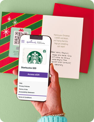 Open Christmas card and a phone with a digital Starbucks gift card on the screen.