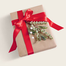 Red ribbon tied around a gift.