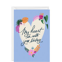 Custom vertical fold card with a heart with flowers on a blue background.