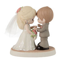 Precious Moments porcelain figurine of a groom putting a ring on his brides finger.