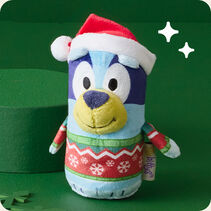 Bluey plush wearing a Christmas sweater and Santa hat.