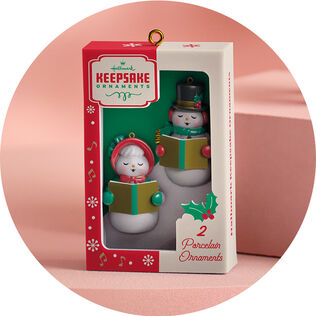 Caroling snowmen in a vintage package ornament