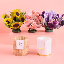 Two folded-paper vases and 3 printed and cut paper flower vase-toppers.