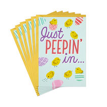 Easter card stack with ‘Just peepin’ in on the front and yellow envelope.