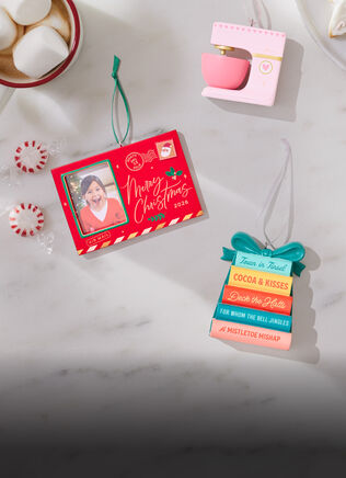 Interest-themed ornaments on a marble tabletop.