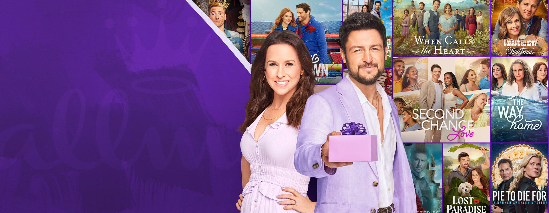 Lacey Chabert and Tyler Hines standing in front of Hallmark holiday movie posters