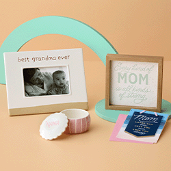 various mothers day gifts | a photo frame, a framed message, a card, a small decorative jar 