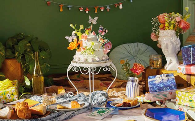 Spread of food and gifts on a blanket with elegant decorations