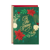 Christmas card with holiday wreath of red poinsettias, white pine cones, gold evergreen sprigs and sparkling red holly and shimmering gold script with glitter, foil and embossed accents