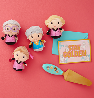 Golden Girls plush figures, a card that reads "Stay golden" and a letter opener