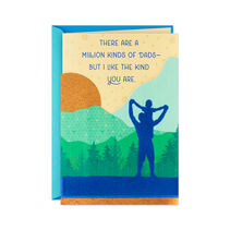 Card with outline of man carrying a kid on his shoulders in the wilderness with “There are a million kinds of dads—But I like the kind you are” on it