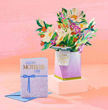 Happy Mothers Day card and bouquet of flowers card on orange and pink watercolor background